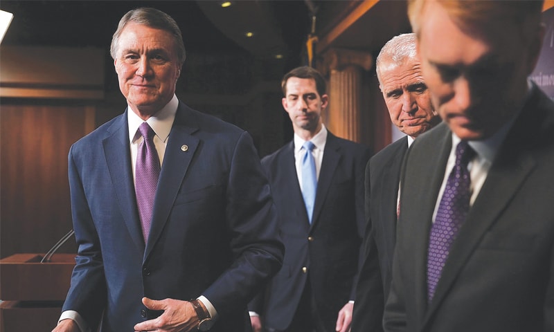 WASHINGTON: US senators leave after a news conference on immigration at the Capitol.&mdash;AFP