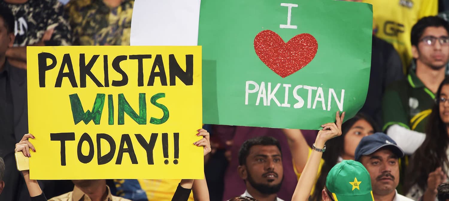 Pakistani spectators hold placards prior to the start of the final cricket match of the Pakistan Super League (PSL) between Quetta Gladiators and Peshawar Zalmi at The Gaddafi Cricket Stadium in Lahore on March 5, 2017. / AFP PHOTO / AAMIR QURESHI &mdash; AFP or licensors