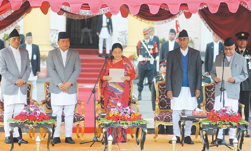 Kathmandu: Khadga Prasad Sharma Oli (right) is being sworn in as Nepal’s prime minister by President Bidhya Bhandari (centre) at the President’s House on Thursday.—AFP Kathmandu: Khadga Prasad Sharma Oli (right) is being sworn in as Nepal’s prime minister by President Bidhya Bhandari (centre) at the President’s House on Thursday.—AFP