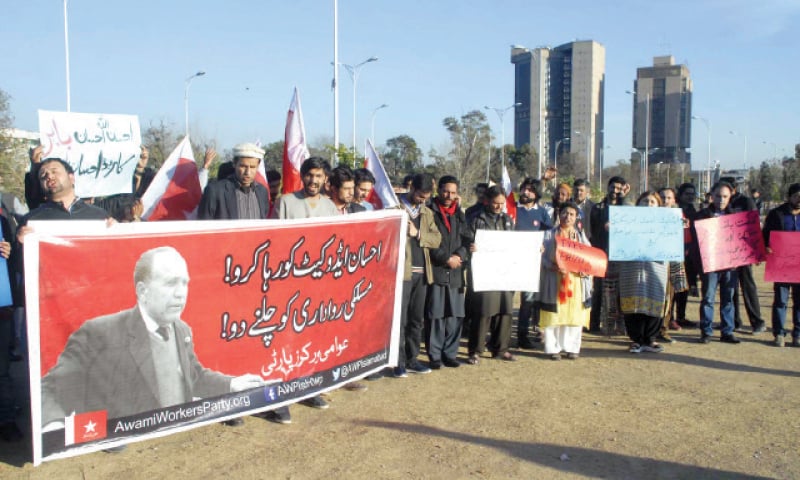 AWP activists hold banners during their protest outside the National Press Club on Sunday. &mdash; Online