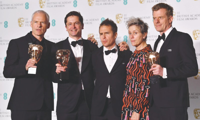 London: Filmmaker Martin McDonagh (left), producer Peter Czernin (second left), supporting actor award winner Sam Rockwell and producer Graham Broadbent (right) pose with leading actress award winner Frances McDormand (second right) after receiving their awards at the ceremony on Sunday.—AFP London: Filmmaker Martin McDonagh (left), producer Peter Czernin (second left), supporting actor award winner Sam Rockwell and producer Graham Broadbent (right) pose with leading actress award winner Frances McDormand (second right) after receiving their awards at the ceremony on Sunday.—AFP