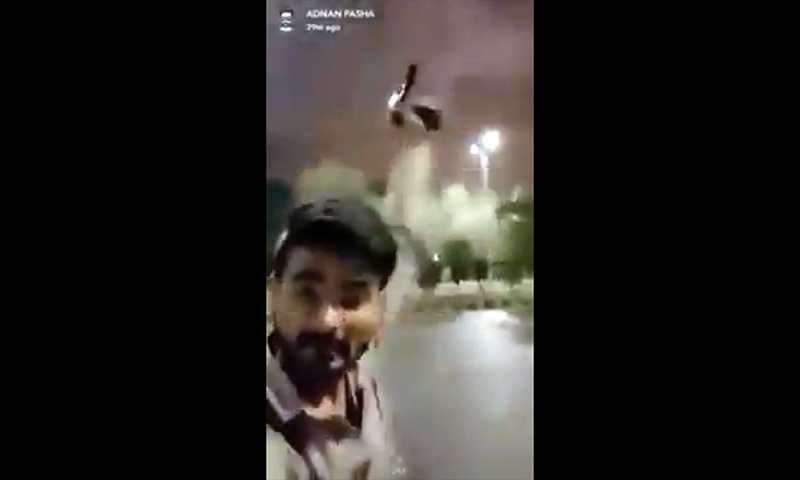 A screengrab of Adnan Pasha's video in which he can be seen firing in the air. &mdash; Facebook