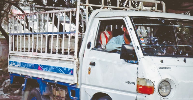 The cage-like truck with bars.