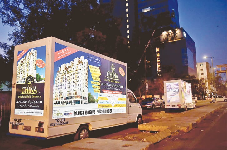 The covered loading truck with advertisements. - Photos by Fahim Siddiqi / White Star