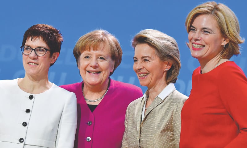BERLIN: (Left to right) Designated secretary general of the Christian Democratic Union Annegret Kramp-Karrenbauer, German Chancellor Angela Merkel, Defence Minister Ursula von der Leyen and CDU politician Julia Kloeckner share a light moment on stage during the party congress on Monday.&mdash;AFP