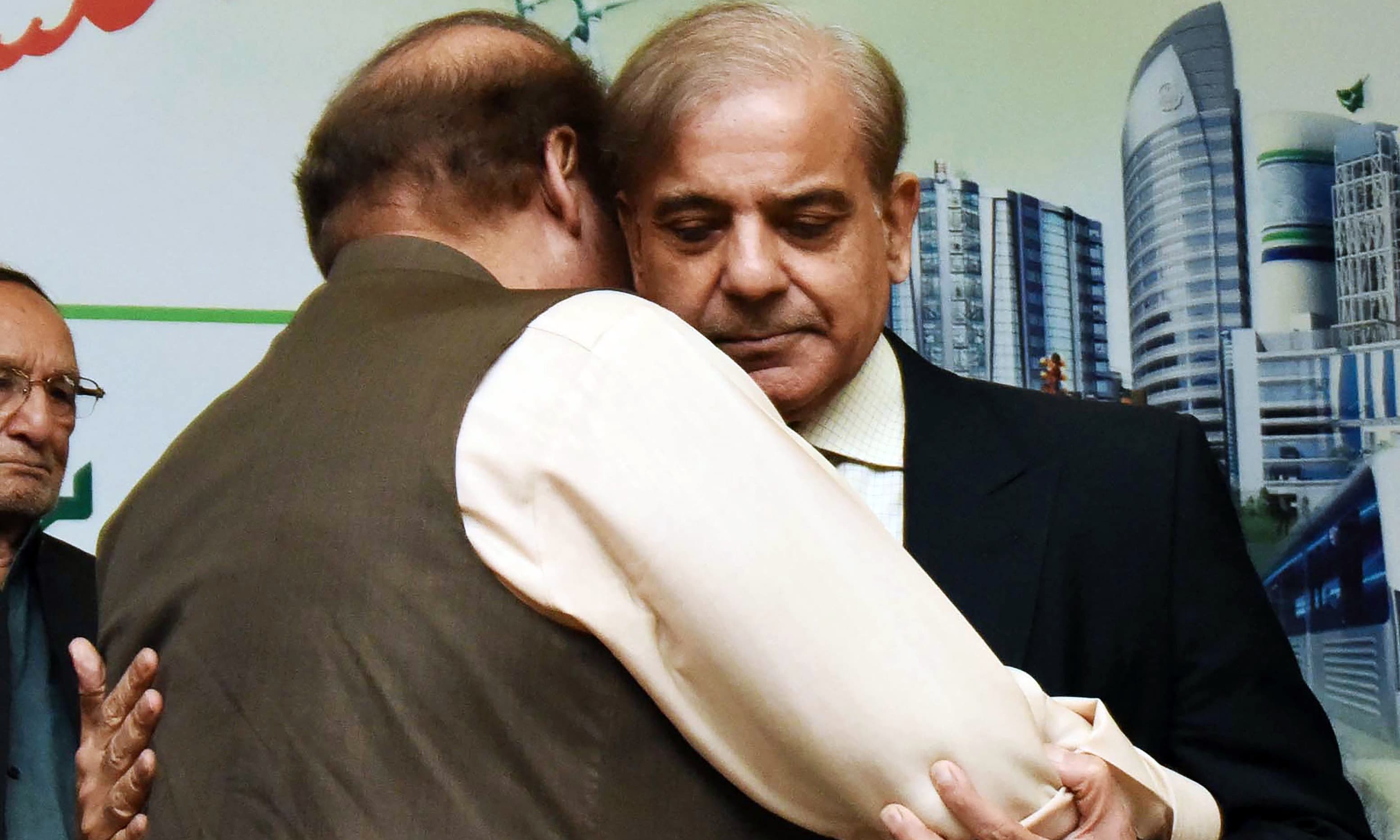 Shahbaz Sharif  hugs his brother Nawaz Sharif after being elected as head of ruling Pakistan Muslim League-Nawaz. —AFP