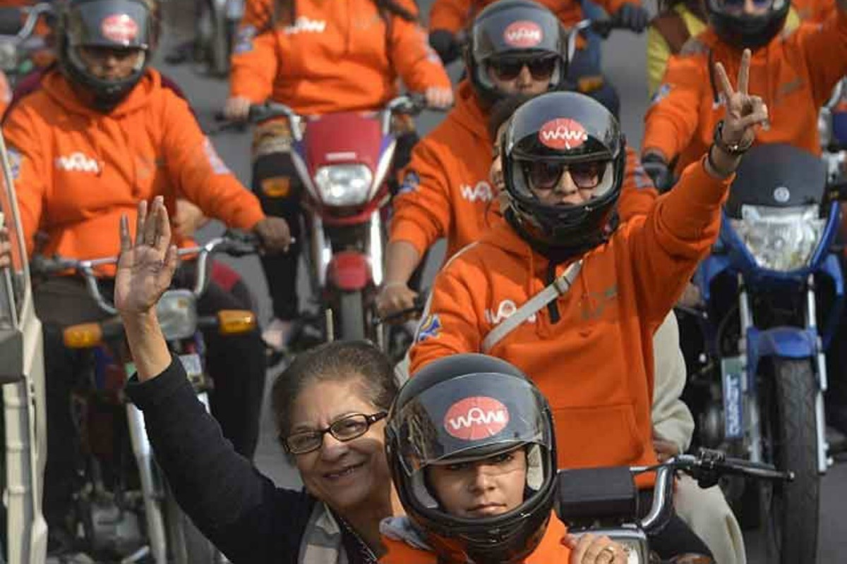 A gleeful Asma Jahangir participates in the Women on Wheels rally in Lahore in 2016