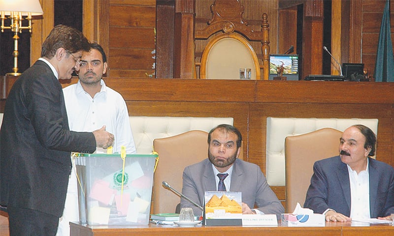 SINDH Chief Minister Murad Ali Shah casts his vote during the Senate election in the Sindh Assembly on Saturday.&mdash;APP