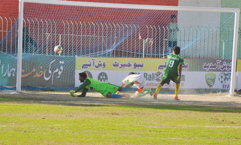 DUKKI forward scores a goal against Labela at the Balochistan Football Cup on Tuesday.