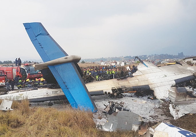 KATHMANDU (Nepal): Photo shows the wreckage of the plane after it crashed near the runway and skidded into a football field.—INP