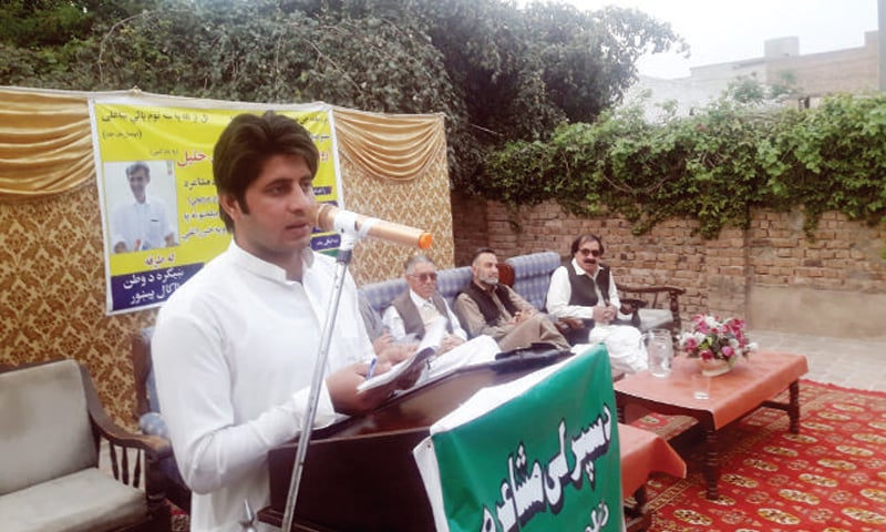 A young poet recites his poem at a spring mushaira in Peshawar on Sunday. &mdash; Dawn