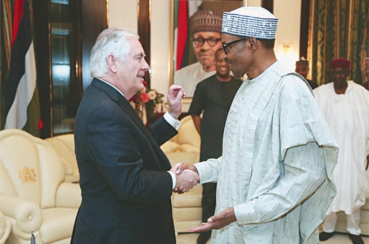 FORMER US Secretary of State Rex Tillerson (left) shakes hands with Nigerian President Muhammadu Buhari at the Presidential Villa in Abuja on March 12. Mr Tillerson was fired a day after by President Donald Trump.—AP