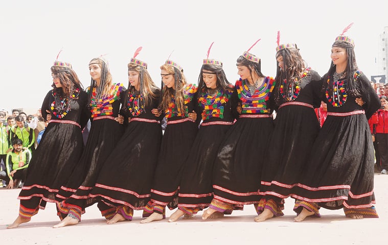 PESHAWAR: Participants perform a traditional Kalash dance during the opening ceremony of the Inter Provincial Games at Qayyum Sports Complex on Sunday. Hosts Khyber Pakhtunkhwa got off to a flying start, grabbing 10 gold medals in taekwondo and a team gold medal in the squash event by defeating Punjab in the finals. &mdash;Shabaz Butt