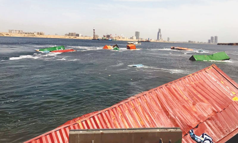 KARACHI: Containers adrift on the sea after a vessel carrying transit-containers collided with a stationary ship at Karachi Port on Monday, causing damage to the fenders. The collision took place when the vessel was being given alongside berth.—Dawn