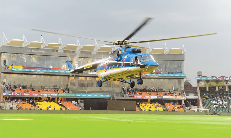 LAHORE: A helicopter hovers over the Gaddafi Stadium pitch in a bid to dry it up for the PSL’s crucial elimination game between Karachi Kings and Peshawar Zalmi here on Wednesday.—AFP LAHORE: A helicopter hovers over the Gaddafi Stadium pitch in a bid to dry it up for the PSL’s crucial elimination game between Karachi Kings and Peshawar Zalmi here on Wednesday.—AFP