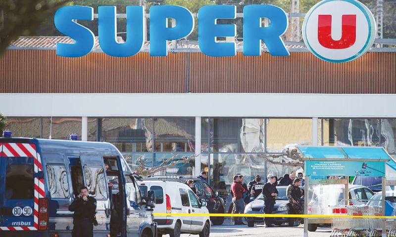 GENDARMES and police officers gather outside the supermarket after a hostage situation developed there on Friday.&mdash;Reuters