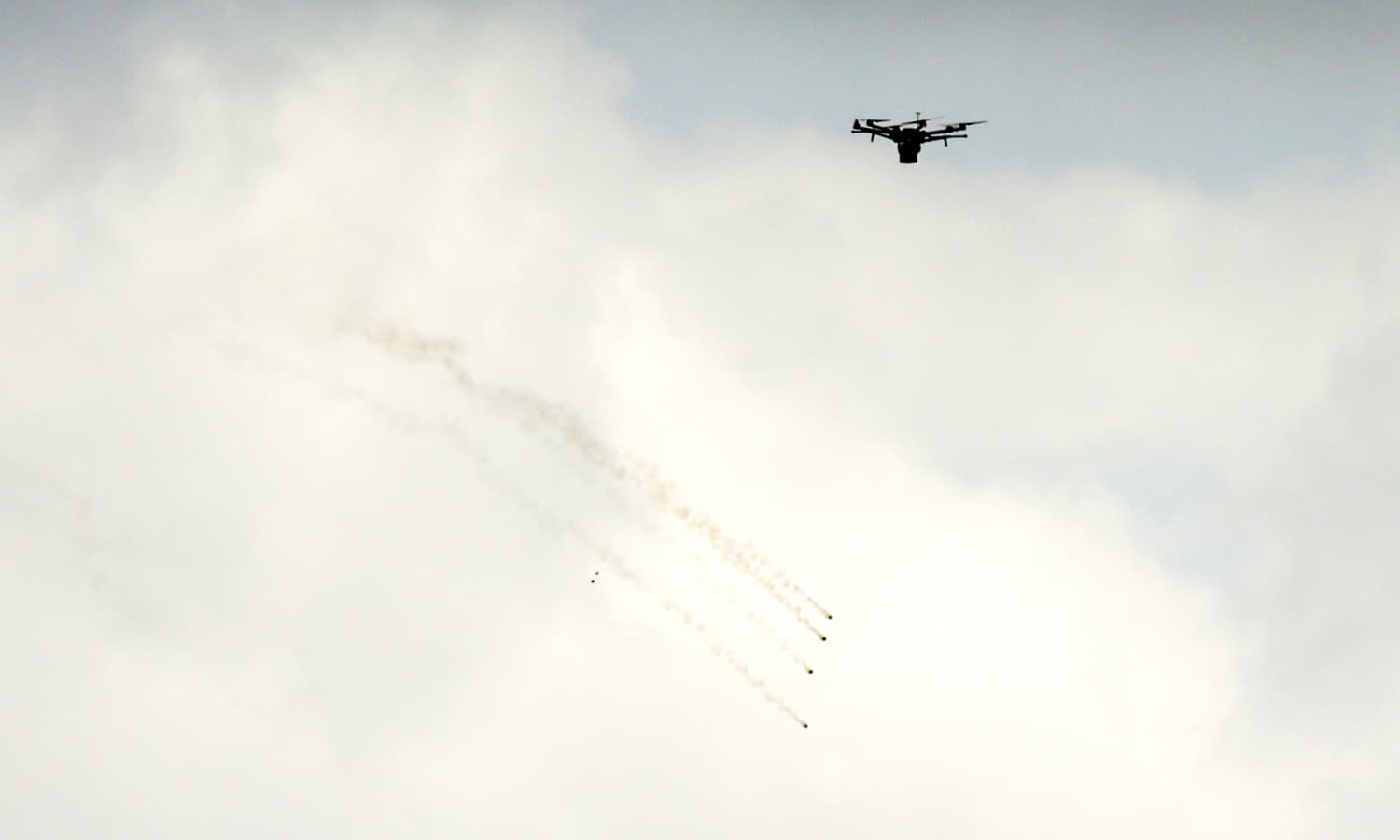 An Israeli drone flying after dropping tear gas grenades during clashes with Palestinian protesters at a tent city protest near the border with Israel. ─AFP