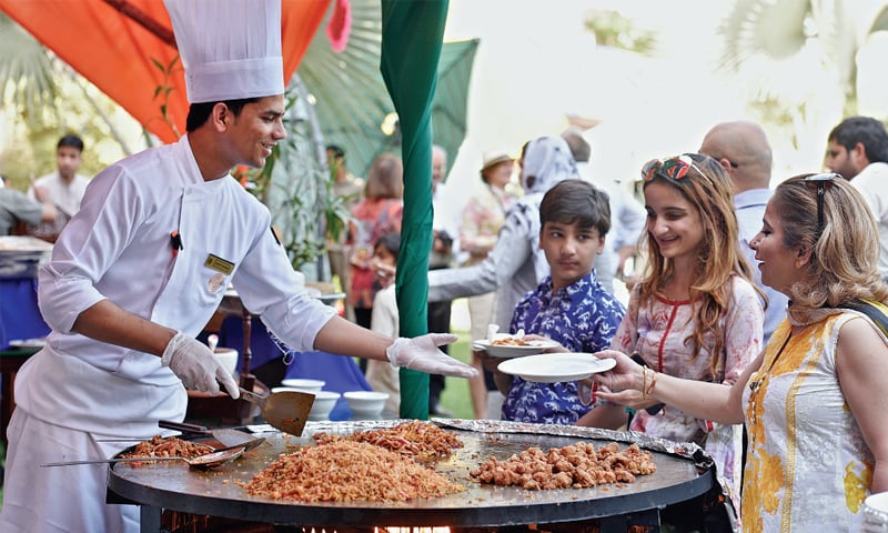 People visit a stall during the Spring Festival on Saturday. &mdash; White Star