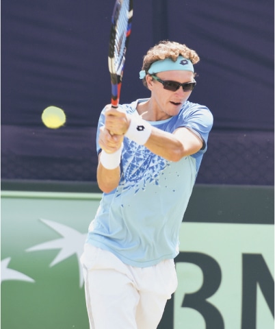 UZBEKISTAN’S Denis Istomin in action against Aqeel Khan of Pakistan during their Davis Cup match at the Pakistan Sports Complex on Saturday.—Tanveer Shahzad/White Star