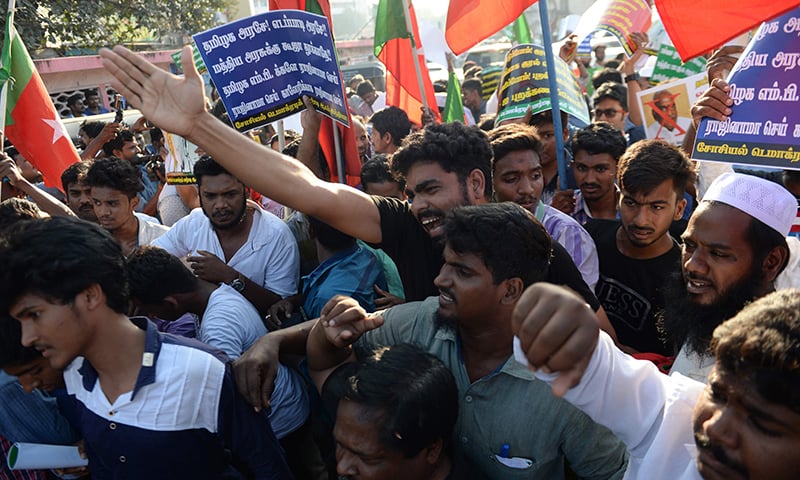 Members of the Tamil ethnic group shout slogans near the the MA Chidhambram cricket stadium — AFP