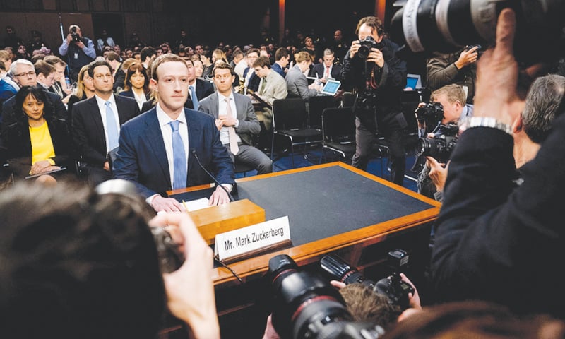 FACEBOOK CEO Mark Zuckerberg before his first congressional hearing on Tuesday.—AP