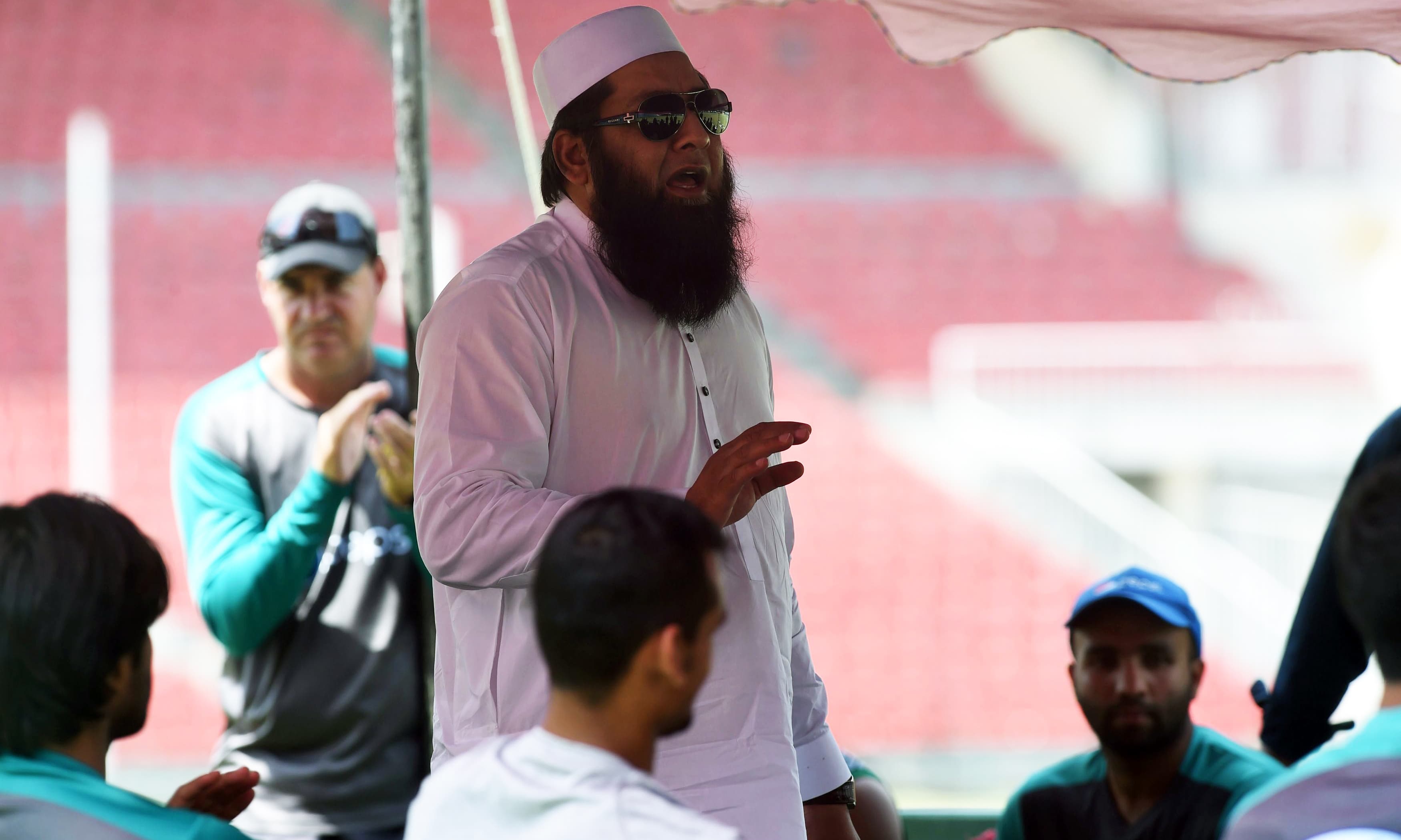 Chief selector Inzamam-ul-Haq speaks with the team during a team practice session in Lahore. —AFP