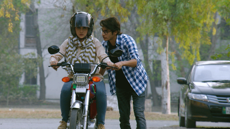 A still of Sohai learning how to ride a bike.