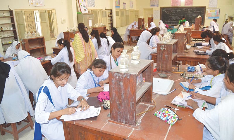 A GROUP of HSC-I exam candidates take their Urdu paper in the science lab of the the Govt Girls Degree College, Latifabad, on Tuesday.—INP A GROUP of HSC-I exam candidates take their Urdu paper in the science lab of the the Govt Girls Degree College, Latifabad, on Tuesday.—INP