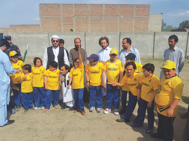 Peshawar Fankaar Zalmi players and organisers at the Karak Cricket Ground