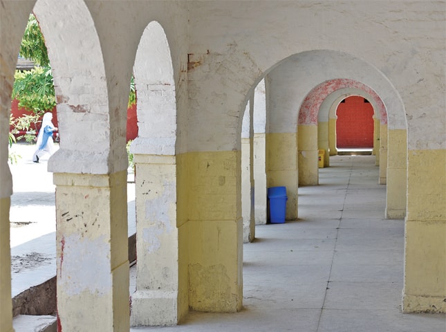 The building&rsquo;s arched veranda, constructed in red brick, was built in the Anglo-Indian style.