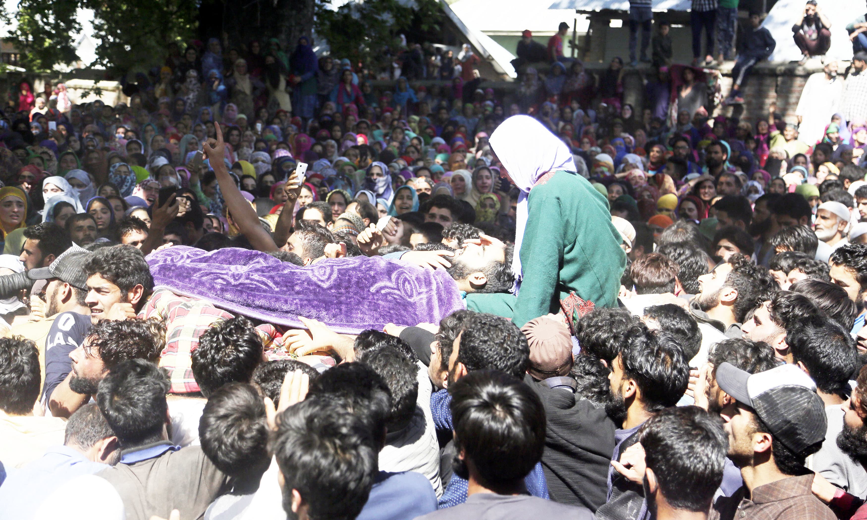 Villagers attend the funeral of Shahid Ahmad who was killed due to firing at protest by Indian troops. —AP