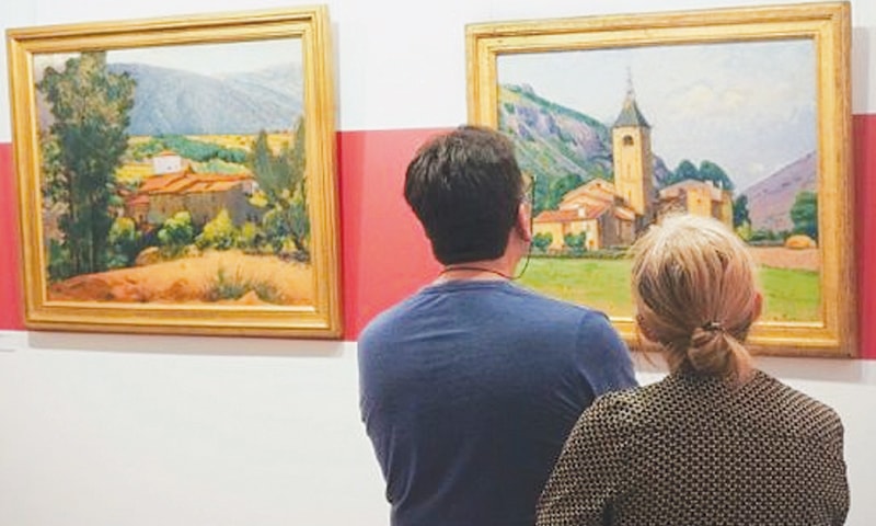 VISITORS admire a painting display at a museum dedicated to French painter Etienne Terrus in Elne, southern France. The museum has reopened after 60 per cent of the paintings were found to be forgeries.&mdash;AFP