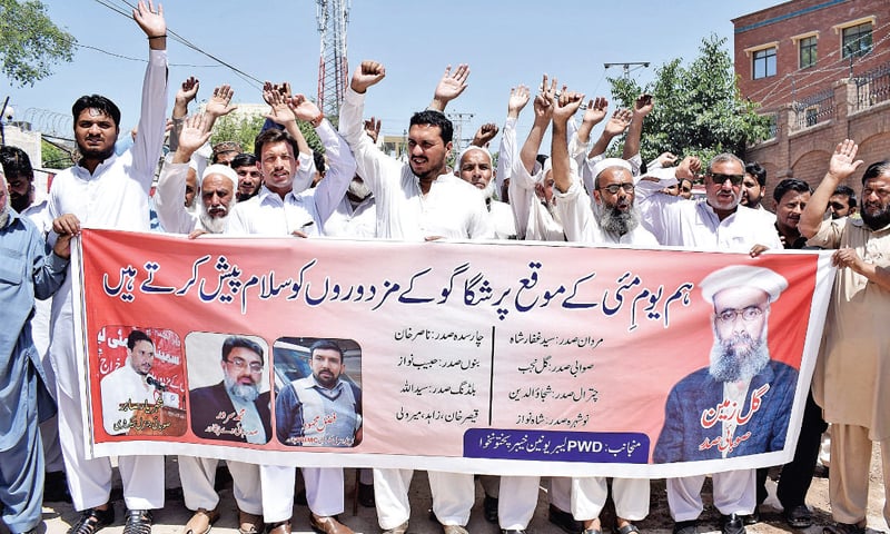 Workers of PWD Labour Union holding a banner during a rally outside Peshawar Press Club on Tuesday. — White Star Workers of PWD Labour Union holding a banner during a rally outside Peshawar Press Club on Tuesday. — White Star