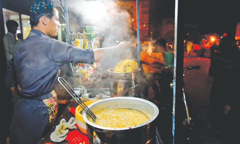 Lal Mohammad busy at his roadside fries stall.