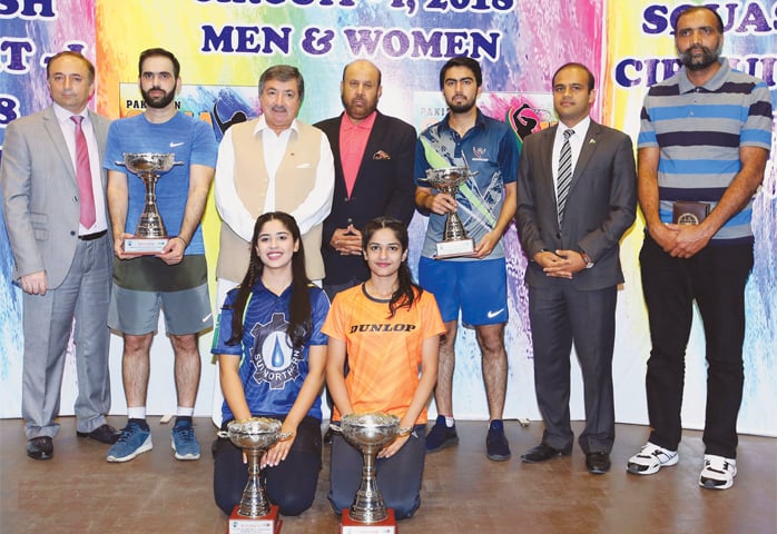 ISLAMABAD: Winners and runners-up of the Pakistan Squash Circuit-I pose with their trophies on Sunday.—INP