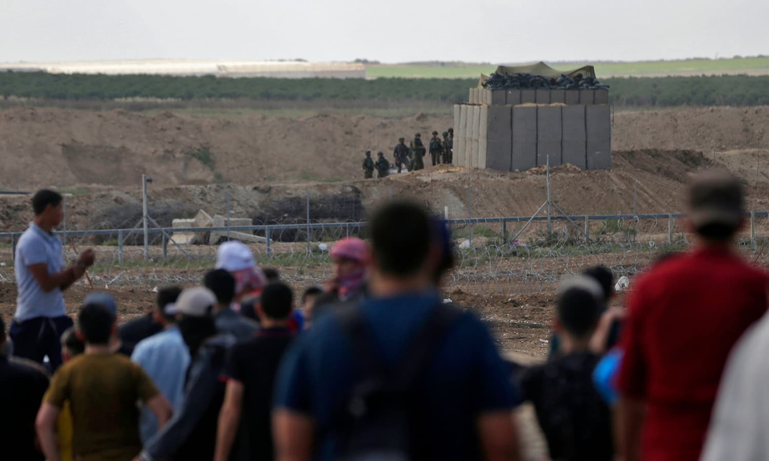 Palestinians confronts Israeli forces near the border between the Gaza strip and Israel east of Gaza City. — AFP