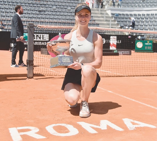 ROME: Ukraine’s Elina Svitolina poses with the trophy after winning the Italian Open final against Simona Halep of Romania at the Foro Italico on Sunday.—AFP