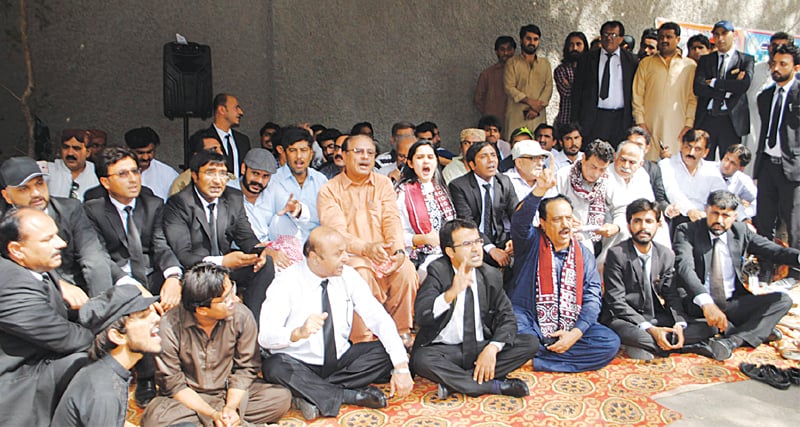 ACTIVISTS of various organisations hold a hunger strike outside the Hyderabad Press Club on Thursday.—Dawn