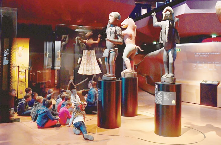 AFRICAN statues, plundered by French troops in 1892 from the kingdom of Dahomey — modern-day Benin — are displayed in Paris’ Quai Branly Museum.—AFP