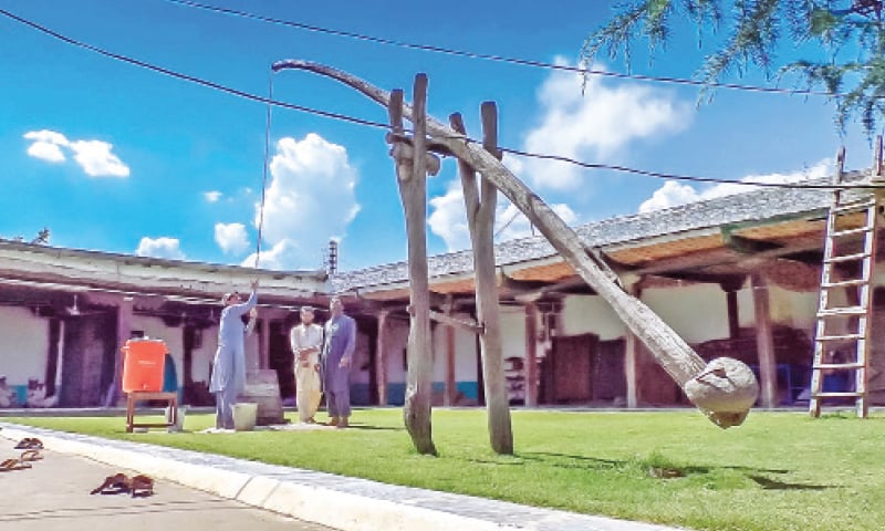 People fetch water from a well through an ancient method known as counterpoise lift. — Dawn People fetch water from a well through an ancient method known as counterpoise lift. — Dawn