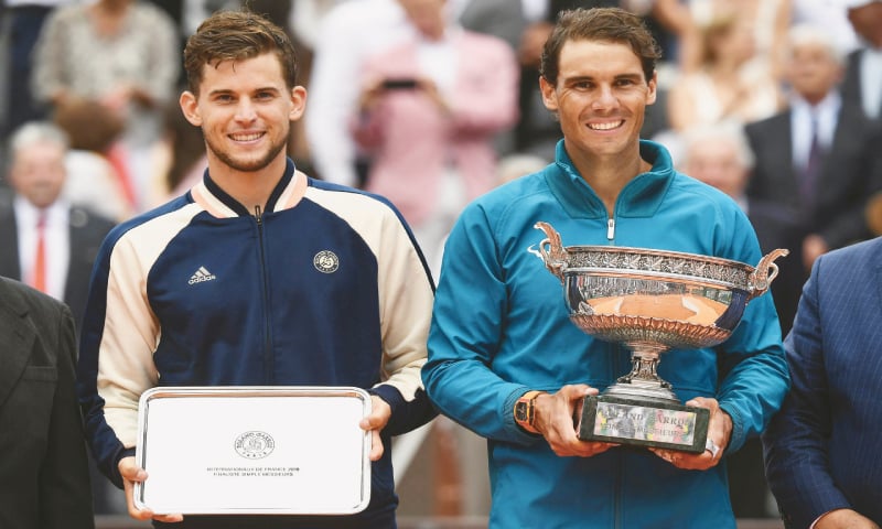 RAFAEL Nadal poses with the Mousquetaires Cup (The Musketeers) after his victory over Austria’s Dominic Thiem (L) in their men’s singles final.—AFP RAFAEL Nadal poses with the Mousquetaires Cup (The Musketeers) after his victory over Austria’s Dominic Thiem (L) in their men’s singles final.—AFP