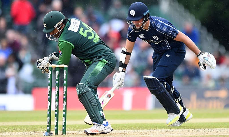 Pakistan's Sarfraz Ahmed (L) takes wicket of Scotland's Mark Watt during the second Twenty20 International cricket match between Scotland and Pakistan. &mdash; AFP
