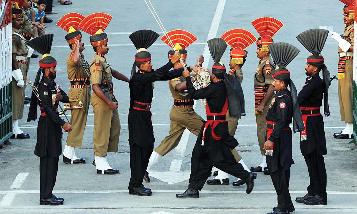 Guards participate in the flag lowering ceremony at Wagah border near Lahore | White Star