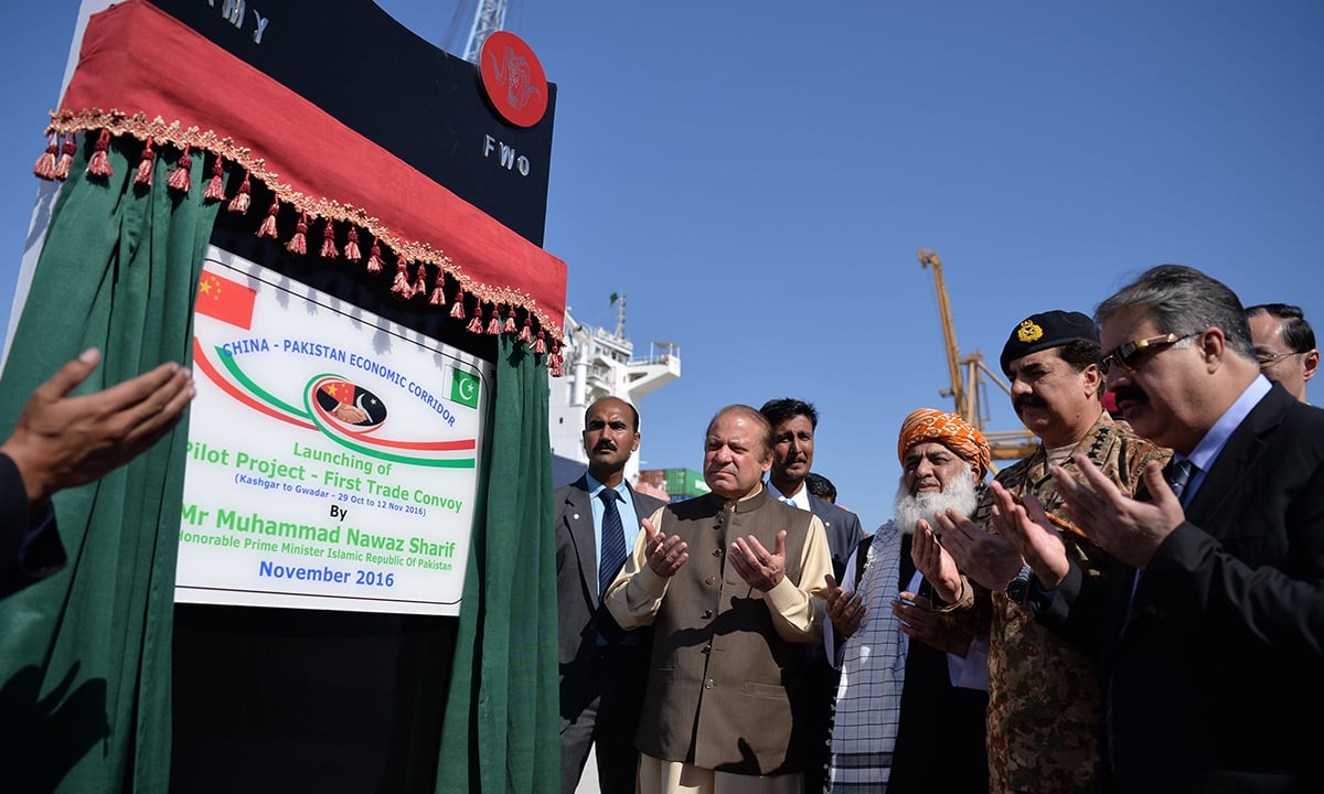 Prime Minister Nawaz Sharif offers prayers at the opening ceremony of a pilot trade project at Gwadar port | AFP