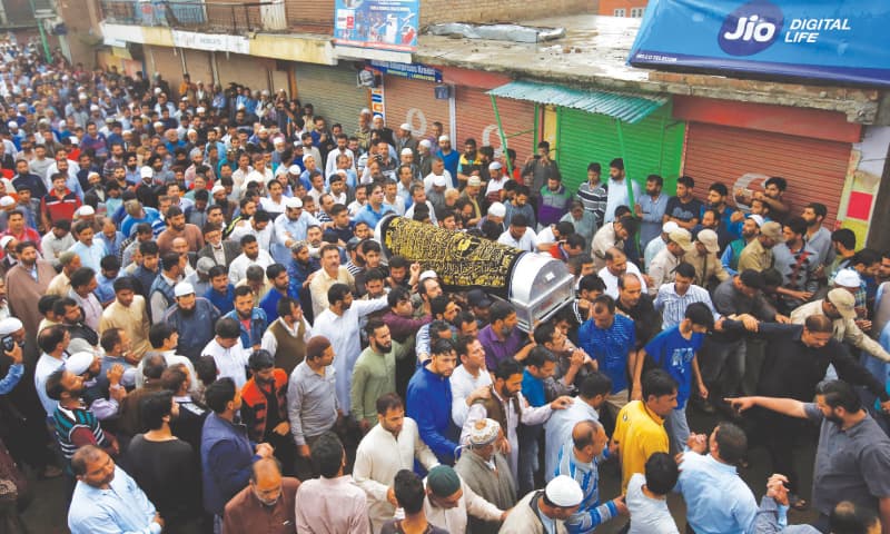 Srinagar: People carry the body of Syed Shujaat Bukhari, the editor-in-chief of Rising Kashmir, during his funeral in Kreeri, north of Srinagar, 
on Friday.—Reuters