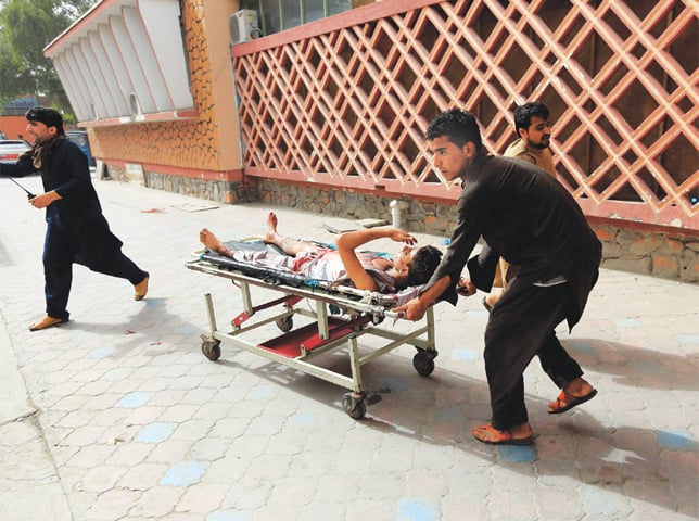 AN injured man is being taken to a hospital after a bomb blast in Jalalabad city of Afghanistan on Sunday.—Reuters