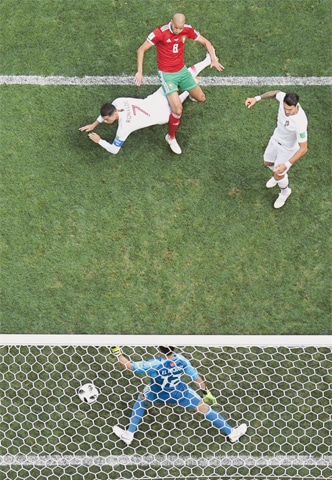 MOSCOW: Portugal’s Cristiano Ronaldo (7) heads to score against Morocco during their Group ‘B’ match at the Luzhniki Stadium on Wednesday.—AFP