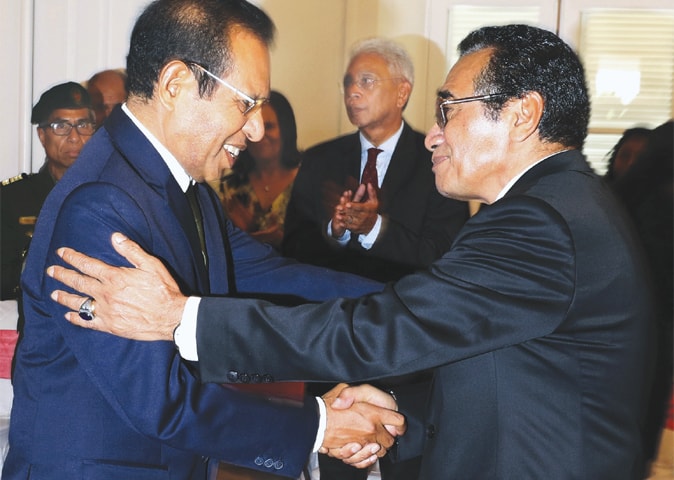 New East Timorese Prime Minister Taur Matan Ruak (left) shake hands with President Francisco Guterres Lu Olo during his inauguration in Dili, the capital of East Timor, on Friday.&mdash;AP