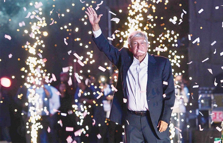 Mexico’s presidential candidate Andres Manuel Lopez Obrador waves to supporters during the last rally of his campaign at the Azteca stadium on Wednesday.—AFP