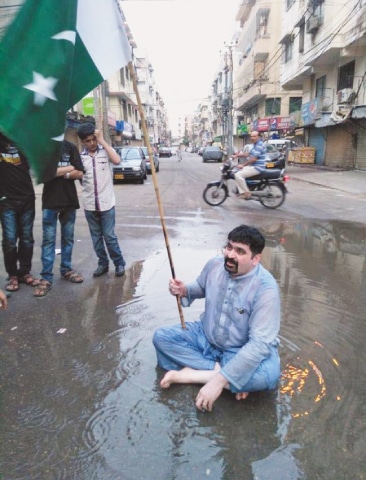 Ayaz Memon Motiwala spent a few hours sitting in sewage, asking for votes.—Online